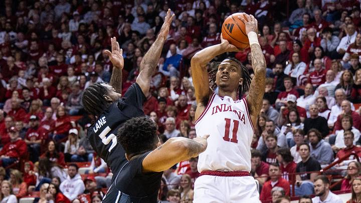 Dec 21, 2023; Bloomington, Indiana, USA; Indiana Hoosiers guard CJ Gunn (11) shoots the ball as North Alabama Lions guard Jacari Lane (5) defends in the first half at Simon Skjodt Assembly Hall. Mandatory Credit: Trevor Ruszkowski-USA TODAY Sports Dec 21, 2023; Bloomington, Indiana, USA; Indiana Hoosiers guard CJ Gunn (11) shoots the ball as North Alabama Lions guard Jacari Lane (5) defends in the first half at Simon Skjodt Assembly Hall. Mandatory Credit: Trevor Ruszkowski-USA TODAY Sports