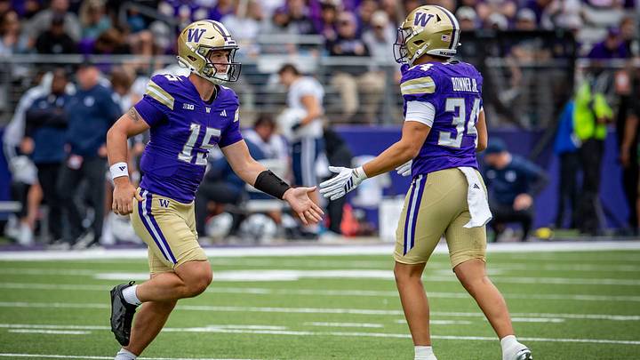 Freshman QB Derek Zammit and freshman back Brian Bonner Jr. slap hands after Zammit's rushing attempt against Utah State. Freshman QB Derek Zammit and freshman back Brian Bonner Jr. slap hands after Zammit's rushing attempt against Utah State.