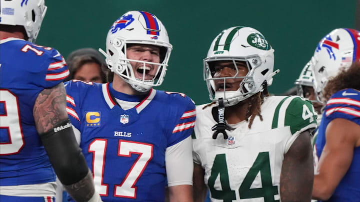 East Rutherford, NJ -- October 14, 2024 -- Josh Allen of Buffalo celebrates a TD in front of Jamien Sherwood of the Jets in the first half. The Buffalo Bills came to MetLife Stadium to play the NY Jets. The Jets played their first game under new interim head coach Jeff Ulbrich.