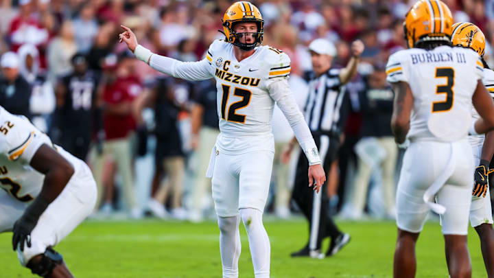 Nov 16, 2024; Columbia, South Carolina, USA; Missouri Tigers quarterback Brady Cook (12) directs his offense against the South Carolina Gamecocks in the first quarter at Williams-Brice Stadium. Mandatory Credit: Jeff Blake-Imagn Images