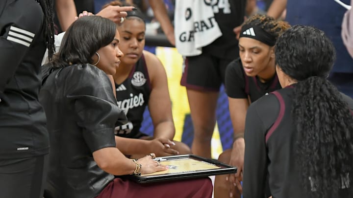 Mar 5, 2025; Greenville, South Carolina, USA; Texas A&M coach Joni Taylor talks with players during the first quarter of the Southeastern Conference Women's Basketball Tournament game with Tennessee at Bon Secours Wellness Arena.  Mandatory Credit: Ken Ruinard/USA TODAY NETWORK via Imagn Images