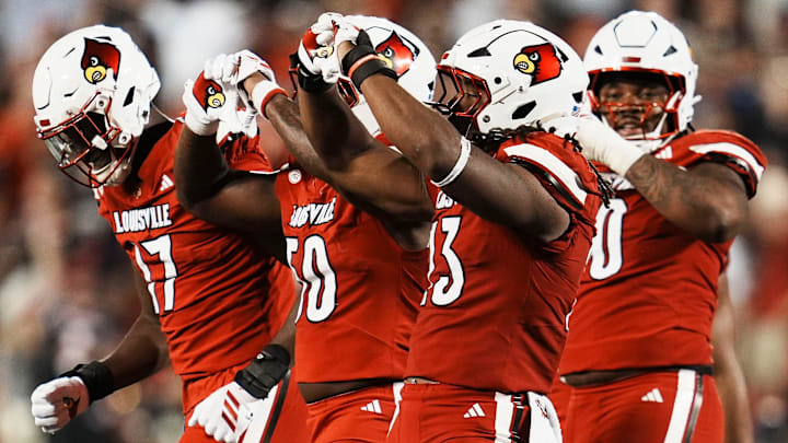 Louisville Cardinals defensive lineman Wesley Bailey (23) makes a heart gesture after his sack against James Madison University in the Card's football game Friday September 5, 2025 at L&N Credit Union Stadium in Louisville, Kentucky. After the game, Bailey said he always does a heart sign after a sack as an honor to his late mother, who was killed when he was five years old. Other Card players have followed his lead.