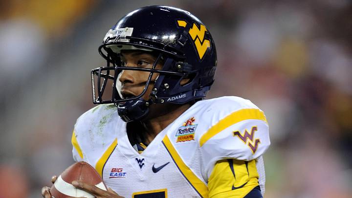 Jan 2, 2008; Glendale, AZ; USA; West Virginia Mountaineers quarterback Pat White (5) scrambles in the second quarter against the Oklahoma Sooners the Fiesta Bowl at University of Phoenix Stadium. Mandatory Credit: Kirby Lee/Image of Sport-USA TODAY Sports