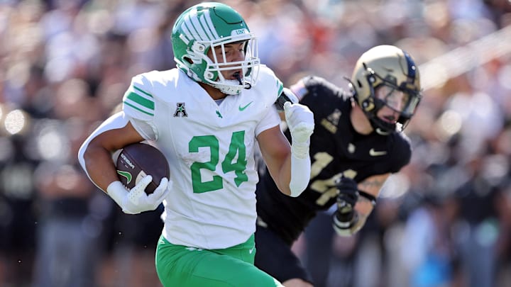 Sep 20, 2025; West Point, New York, USA; North Texas Mean Green running back Caleb Hawkins (24) runs for a touchdown against the Army Black Knights during the second half at Michie Stadium. Mandatory Credit: Danny Wild-Imagn Images