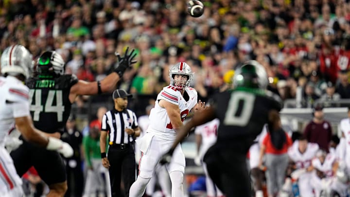 Oct 12, 2024; Eugene, Oregon, USA; Ohio State Buckeyes quarterback Will Howard (18) throws the ball against the Oregon Ducks defense in the second half during the NCAA football game at Autzen Stadium.