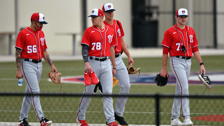 Feb 25, 2021; West Palm Beach, Florida, USA; Seth Romero (56), Cade Cavalli (78), Jackson Rutledge (79) and Cole Henry (71) of the Washington Nationals walk to workouts during spring training at The Ballpark of the Palm Beaches. Feb 25, 2021; West Palm Beach, Florida, USA; Seth Romero (56), Cade Cavalli (78), Jackson Rutledge (79) and Cole Henry (71) of the Washington Nationals walk to workouts during spring training at The Ballpark of the Palm Beaches.