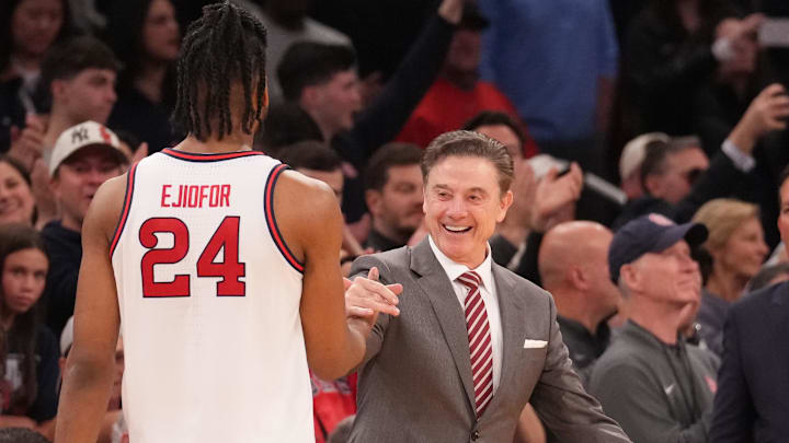 Mar 15, 2025; New York, NY, USA; St. John's Red Storm forward Zuby Ejiofor (24) is greeted by St. John's Red Storm head coach Rick Pitino as the game ends against the Creighton Bluejays at Madison Square Garden. Mar 15, 2025; New York, NY, USA; St. John's Red Storm forward Zuby Ejiofor (24) is greeted by St. John's Red Storm head coach Rick Pitino as the game ends against the Creighton Bluejays at Madison Square Garden.