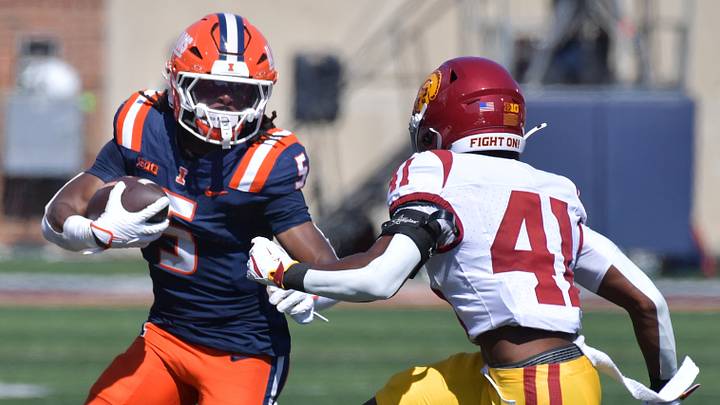 Sep 27, 2025; Champaign, Illinois, USA; Illinois Fighting Illini running back Ca'Lil Valentine (5) runs the ball as Southern California Trojans safety Kendarius Reddick (41) defends during the first half at Memorial Stadium. Mandatory Credit: Ron Johnson-Imagn Images Sep 27, 2025; Champaign, Illinois, USA; Illinois Fighting Illini running back Ca'Lil Valentine (5) runs the ball as Southern California Trojans safety Kendarius Reddick (41) defends during the first half at Memorial Stadium. Mandatory Credit: Ron Johnson-Imagn Images