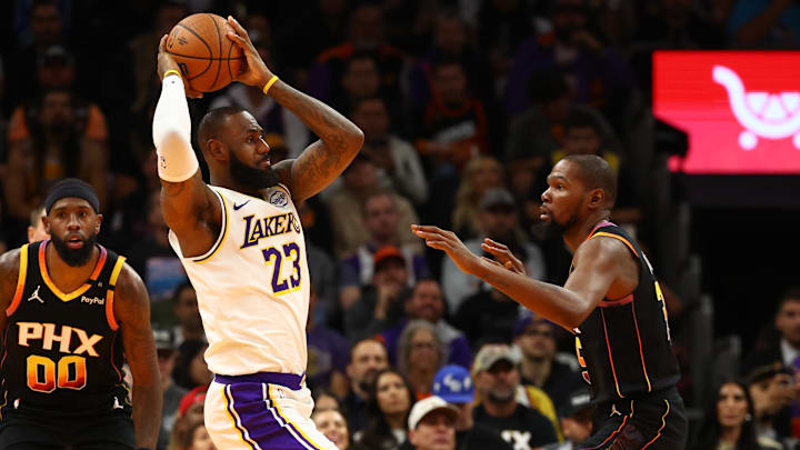 Nov 26, 2024; Phoenix, Arizona, USA: Los Angeles Lakers forward LeBron James (23) against Phoenix Suns forward Kevin Durant (35) during an NBA Cup game at Footprint Center. Mandatory Credit: Mark J. Rebilas-Imagn Images