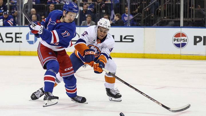 Sep 22, 2026; New York, New York, USA; New York Rangers right wing Eeli Tolvanen (17) and New York Islanders defenseman Kashawn Aitcheson (37) battle for control of the puck in the second period at Madison Square Garden. Mandatory Credit: Wendell Cruz-Imagn Images Sep 22, 2026; New York, New York, USA; New York Rangers right wing Eeli Tolvanen (17) and New York Islanders defenseman Kashawn Aitcheson (37) battle for control of the puck in the second period at Madison Square Garden. Mandatory Credit: Wendell Cruz-Imagn Images