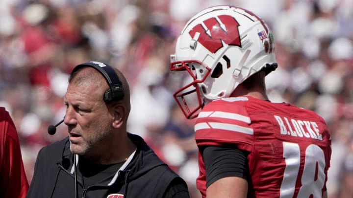 Wisconsin offensive coordinator Phil Longo is shown with quarterback Braedyn Locke (18) during the third quarter of their game Saturday, September 14, 2024 at Camp Randall Stadium in Madison, Wisconsin. Alabama beat Wisconsin 42-10.