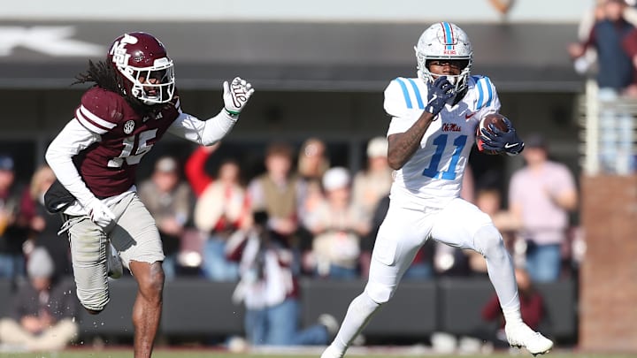 Nov 28, 2025; Starkville, Mississippi, USA; Mississippi Rebels wide receiver Deuce Alexander (11) runs against Mississippi State Bulldogs cornerback Jayven Williams (15) in the second half at Davis Wade Stadium at Scott Field. Mandatory Credit: Petre Thomas-Imagn Images