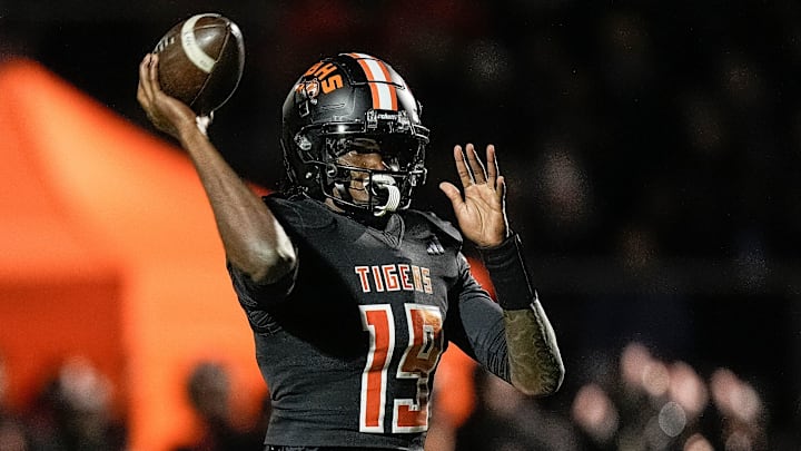 Belleville quarterback Bryce Underwood makes a pass against Saline during the first half of district final at Belleville High School in Belleville on Friday, Nov. 8, 2024.