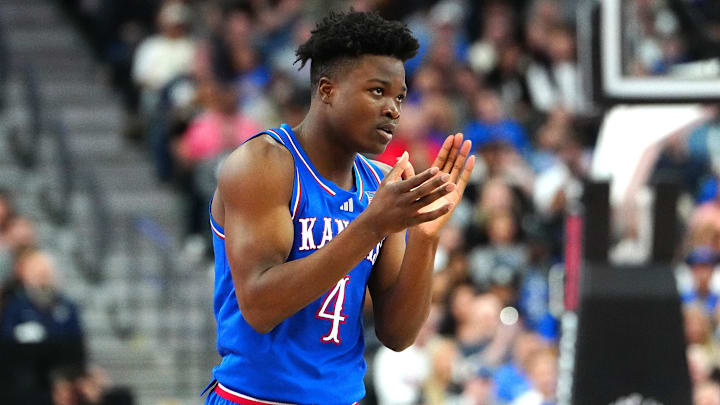 Nov 26, 2024; Las Vegas, Nevada, USA; Kansas Jayhawks guard Rakease Passmore (4) applauds after a play against the Duke Blue Devils during the first half at T-Mobile Arena. Mandatory Credit: Stephen R. Sylvanie-Imagn Images
