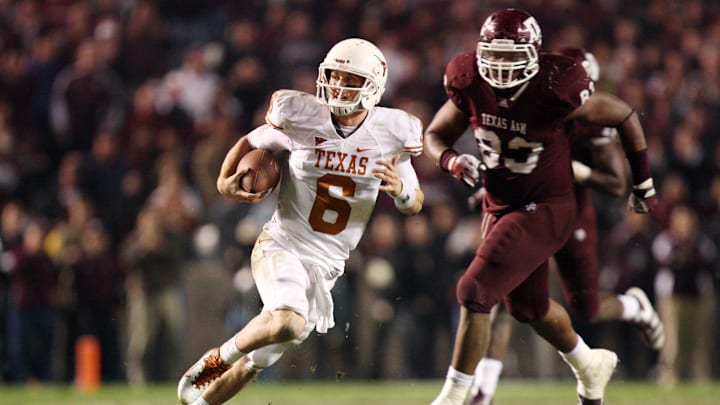 Nov 24, 2011; College Station, TX, USA; Texas Longhorns quarterback Case McCoy (6) scrambles from Texas A&M Aggies defensive lineman Tony Jerod-Eddie (83) during the second half at Kyle Field. Texas won 27-25. Mandatory Credit: Thomas Campbell-US Presswire Nov 24, 2011; College Station, TX, USA; Texas Longhorns quarterback Case McCoy (6) scrambles from Texas A&M Aggies defensive lineman Tony Jerod-Eddie (83) during the second half at Kyle Field. Texas won 27-25. Mandatory Credit: Thomas Campbell-US Presswire