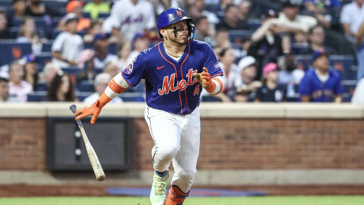 Jun 26, 2024; New York City, New York, USA;  New York Mets catcher Francisco Alvarez (4) hits a two run home run in the third inning against the New York Yankees at Citi Field. Mandatory Credit: Wendell Cruz-USA TODAY Sports