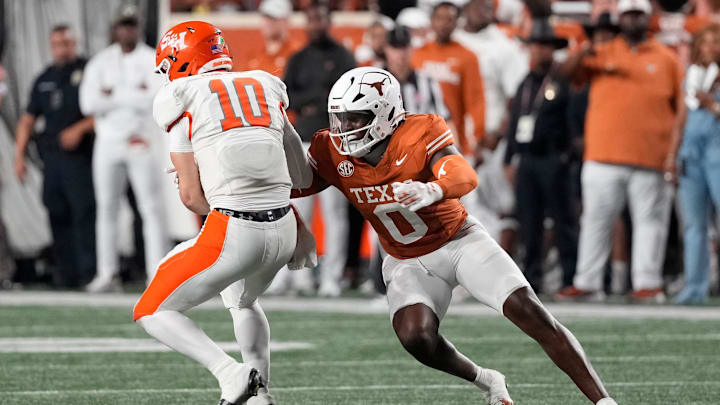 Texas Longhorns linebacker Anthony Hill Jr (0) tackles Sam Houston Bearkats quarterback Texas Longhorns linebacker Anthony Hill Jr (0) tackles Sam Houston Bearkats quarterback