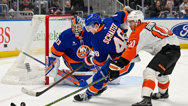 Nov 28, 2025; Elmont, New York, USA; New York Islanders defenseman Matthew Schaefer (48) and Philadelphia Flyers right wing Bobby Brink (10) battle for the puck during the third period at UBS Arena. Mandatory Credit: Dennis Schneidler-Imagn Images Nov 28, 2025; Elmont, New York, USA; New York Islanders defenseman Matthew Schaefer (48) and Philadelphia Flyers right wing Bobby Brink (10) battle for the puck during the third period at UBS Arena. Mandatory Credit: Dennis Schneidler-Imagn Images