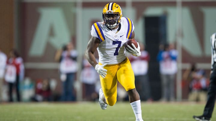 Nov 12, 2016; Fayetteville, AR, USA; LSU Tigers running back Leonard Fournette (7) runs for a large gain after a reception during the first quarter of the game against the Arkansas Razorbacks at Donald W. Reynolds Razorback Stadium. Mandatory Credit: Brett Rojo-Imagn Images