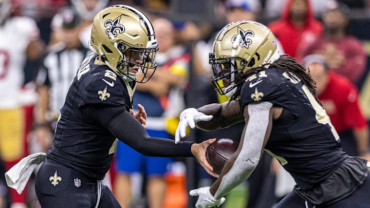 Sep 14, 2025; New Orleans, Louisiana, USA;  New Orleans Saints quarterback Spencer Rattler (2) hands off to running back Alvin Kamara (41) against the San Francisco 49ers during the second half at Caesars Superdome. Mandatory Credit: Stephen Lew-Imagn Images