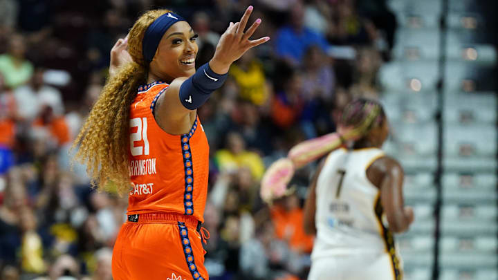 Connecticut Sun guard DiJonai Carrington reacts after a three-point basket against the Indiana Fever.