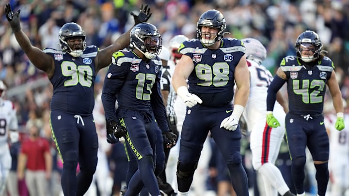 Feb 8, 2026; Santa Clara, CA, USA; Seattle Seahawks defensive tackle Rylie Mills (98) reacts after sacking New England Patriots quarterback Drake Maye (10) during the second quarter in Super Bowl LX at Levi's Stadium. 