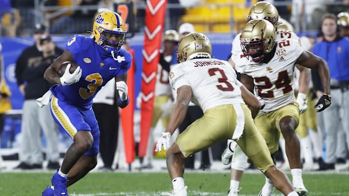 Nov 16, 2023; Pittsburgh, Pennsylvania, USA; Pittsburgh Panthers wide receiver Daejon Reynolds (3) runs after a  catch against Boston College Eagles defensive back Khari Johnson (3) during the second quarter at Acrisure Stadium. Mandatory Credit: Charles LeClaire-Imagn Images