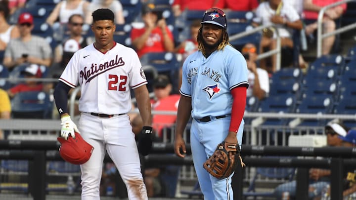 Aug 18, 2021; Washington, District of Columbia, USA; Washington Nationals right fielder Juan Soto (22) talks with Toronto Blue Jays designated hitter Vladimir Guerrero Jr. (27) during the fifth inning at Nationals Park. Mandatory Credit: Brad Mills-Imagn Images