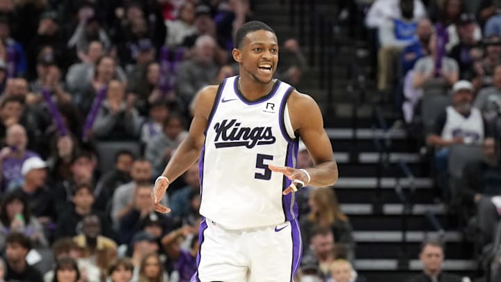 Dec 30, 2024; Sacramento, California, USA; Sacramento Kings guard De'Aaron Fox (5) reacts after scoring against the Dallas Mavericks during the fourth quarter at Golden 1 Center. Mandatory Credit: Darren Yamashita-Imagn Images
