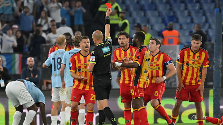 Referee Michael Fabbri shows the red card to Santiago...