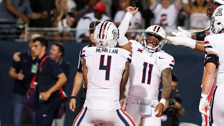 Aug 31, 2024; Tucson, Arizona, USA; Arizona Wildcats wide receiver Tetairoa McMillan (4) celebrates a touchdown with Arizona Wildcats quarterback Noah Fifita (11) against the New Mexico Lobos during the first quarter at Arizona Stadium. Aug 31, 2024; Tucson, Arizona, USA; Arizona Wildcats wide receiver Tetairoa McMillan (4) celebrates a touchdown with Arizona Wildcats quarterback Noah Fifita (11) against the New Mexico Lobos during the first quarter at Arizona Stadium.