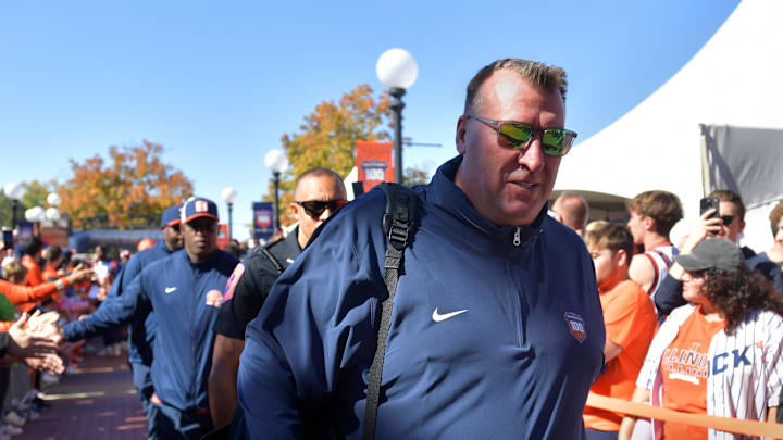 Oct 19, 2024; Champaign, Illinois, USA; Illinois Fighting Illini head coach Bret Bielema leads his team into the stadium before kickoff against the Michigan Wolverines game at Memorial Stadium. Mandatory Credit: Ron Johnson-Imagn Images