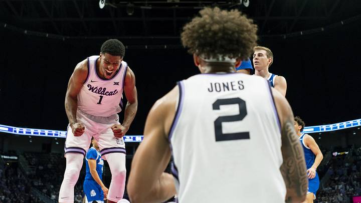 Dec 17, 2024; Kansas City, Missouri, USA; Kansas State Wildcats guard David N'Guessan (1) celebrates with guard Max Jones (2) after a play during the second half against the Drake Bulldogs at T-Mobile Center. Mandatory Credit: Jay Biggerstaff-Imagn Images Dec 17, 2024; Kansas City, Missouri, USA; Kansas State Wildcats guard David N'Guessan (1) celebrates with guard Max Jones (2) after a play during the second half against the Drake Bulldogs at T-Mobile Center. Mandatory Credit: Jay Biggerstaff-Imagn Images