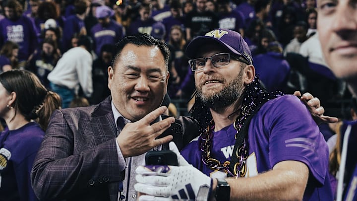 Pat Chun obliges a fan with a postgame selfie. 