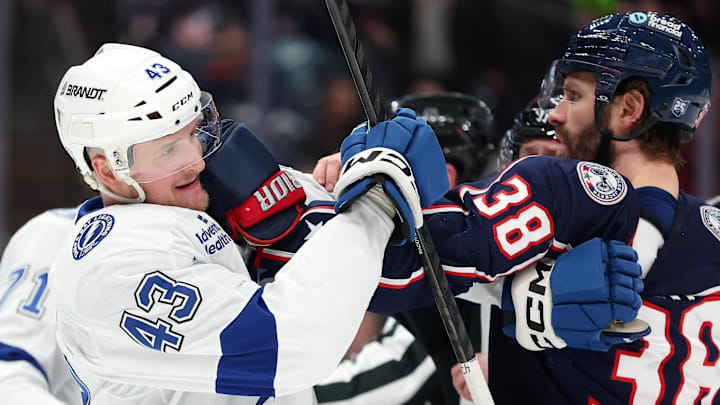 Lightning defenseman Darren Raddysh jostles with Blue Jackets forward Boone Jenner.