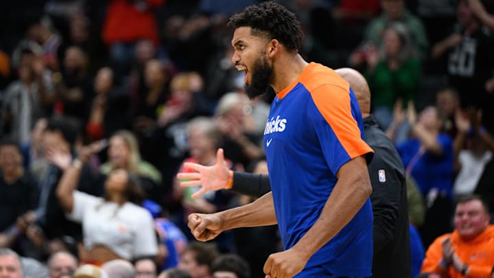 Oct 18, 2024; Washington, District of Columbia, USA; New York Knicks center Karl-Anthony Towns (32) reacts on the bench during the fourth quarter against the Washington Wizards at Capital One Arena. Mandatory Credit: Reggie Hildred-Imagn Images