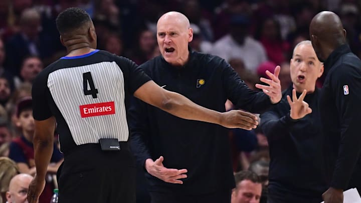 May 4, 2025; Cleveland, Ohio, USA: Indiana Pacers head coach Rick Carlisle argues a call with referee Sean Wright (4) during the first half against the Cleveland Cavaliers in game one of the second round for the 2025 NBA Playoffs at Rocket Arena. Mandatory Credit: Ken Blaze-Imagn Images