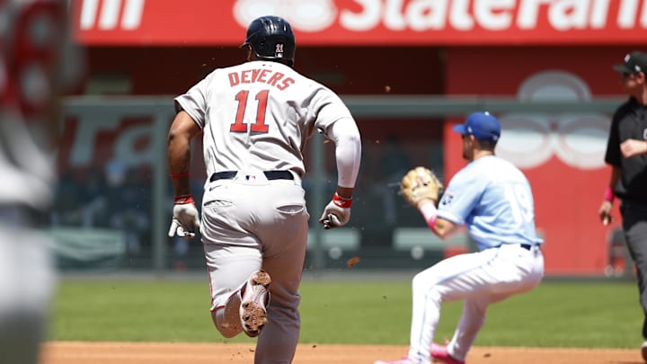 May 11, 2025; Kansas City, Missouri, USA; Boston Red Sox third base Rafael Devers (11) gets forced out at second base at Kauffman Stadium. Mandatory Credit: Gary Rohman-Imagn Images