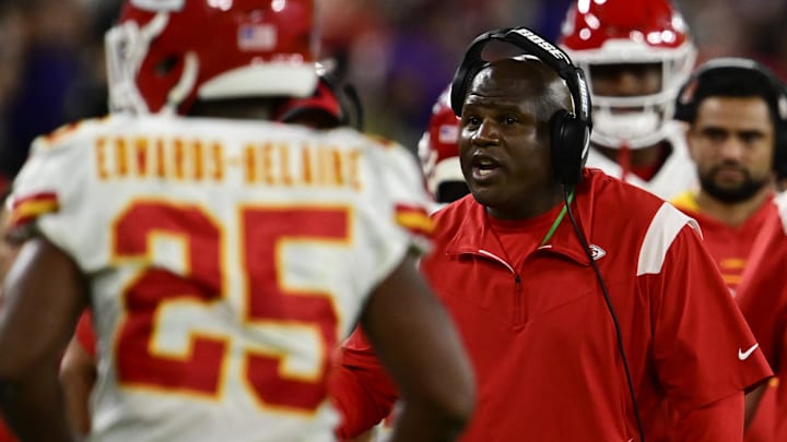 Sep 19, 2021; Baltimore, Maryland, USA;  Kansas City Chiefs offensive coordinator Eric Bieniemy  talks with players after the play during the first half against the Baltimore Ravens at M&T Bank Stadium. Mandatory Credit: Tommy Gilligan-Imagn Images