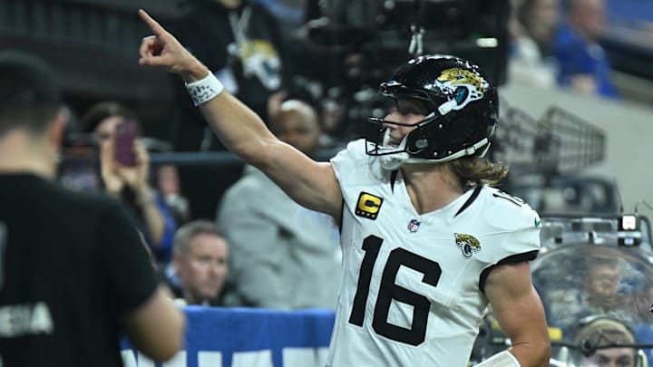 Jacksonville Jaguars quarterback Trevor Lawrence (16) reacts after a touchdown