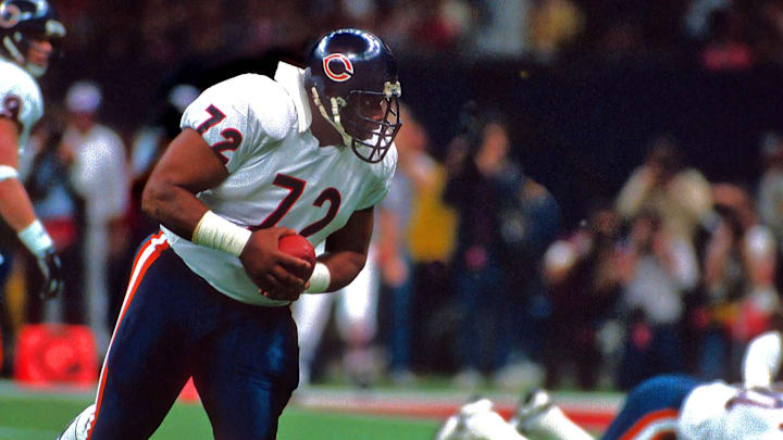 Jan 26, 1986; New Orleans, LA, USA; FILE PHOTO; Chicago Bears defensive tackle (72) William Perry, playing on offense, takes a handoff and runs the football against the New England Patriots during Super Bowl XX at the Superdome. The Bears defeated the Patriots 46-10. Jan 26, 1986; New Orleans, LA, USA; FILE PHOTO; Chicago Bears defensive tackle (72) William Perry, playing on offense, takes a handoff and runs the football against the New England Patriots during Super Bowl XX at the Superdome. The Bears defeated the Patriots 46-10.