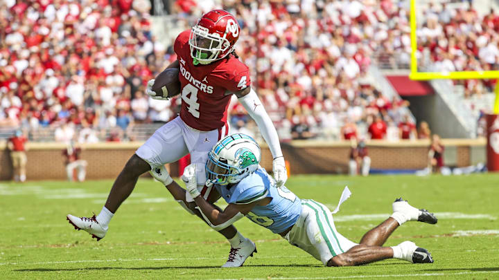Former Oklahoma Sooners wide receiver Mario Williams (4) runs past Tulane Green Wave defensive back Jadon Canady in 2021. Former Oklahoma Sooners wide receiver Mario Williams (4) runs past Tulane Green Wave defensive back Jadon Canady in 2021.