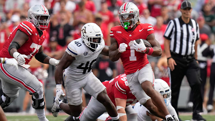 Aug 31, 2024; Columbus, OH, USA; Ohio State Buckeyes running back Quinshon Judkins (1) runs past Akron Zips linebacker Bryan McCoy (40) during the first half of the NCAA football game at Ohio Stadium. Aug 31, 2024; Columbus, OH, USA; Ohio State Buckeyes running back Quinshon Judkins (1) runs past Akron Zips linebacker Bryan McCoy (40) during the first half of the NCAA football game at Ohio Stadium.