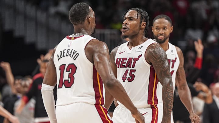 Apr 18, 2025; Atlanta, Georgia, USA; Miami Heat guard Davion Mitchell (45) reacts with center Bam Adebayo (13) after the Heat defeated the Atlanta Hawks in overtime at State Farm Arena. Mandatory Credit: Dale Zanine-Imagn Images Apr 18, 2025; Atlanta, Georgia, USA; Miami Heat guard Davion Mitchell (45) reacts with center Bam Adebayo (13) after the Heat defeated the Atlanta Hawks in overtime at State Farm Arena. Mandatory Credit: Dale Zanine-Imagn Images