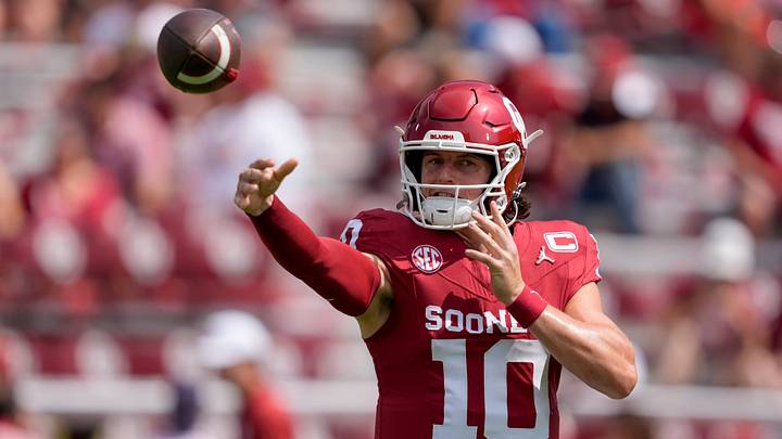 Oklahoma quarterback John Mateer warms up before a game at Gaylord Oklahoma-Memorial Stadium.