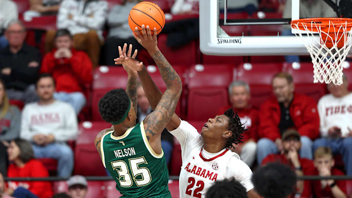 USF's Izaiyah Nelson goes for two of his team-high 25 points for the Bulls as they battled Alabama