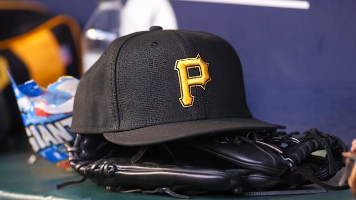 Sep 8, 2023; Atlanta, Georgia, USA; A detailed view of a Pittsburgh Pirates hat and glove before a game against the Pittsburgh Pirates in the first inning at Truist Park. Mandatory Credit: Brett Davis-Imagn Images
