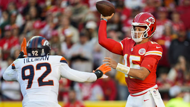 Nov 10, 2024; Kansas City, Missouri, USA; Kansas City Chiefs quarterback Patrick Mahomes (15) throws a pass against Denver Broncos linebacker Dondrea Tillman (92) during the second half at GEHA Field at Arrowhead Stadium. Mandatory Credit: Jay Biggerstaff-Imagn Images