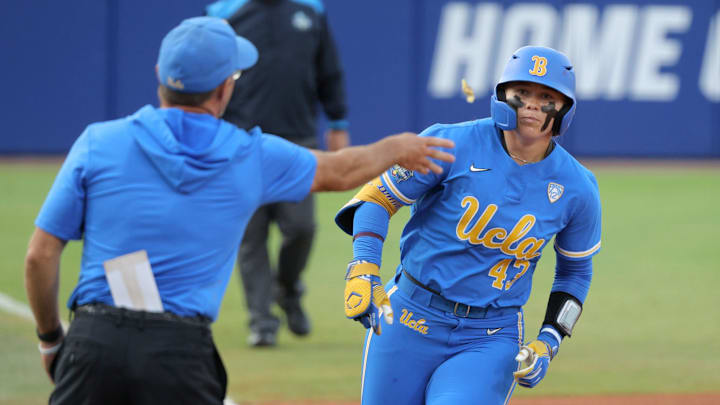 UCLA's Megan Grant (43) is tossed a piece of candy after hitting a home run in the second inning of a Women's College World Series softball game between the Stanford Cardinal and the UCLA Bruins at Devon Park in Oklahoma City, Sunday, June 2, 2024. Stanford won 3-1. UCLA's Megan Grant (43) is tossed a piece of candy after hitting a home run in the second inning of a Women's College World Series softball game between the Stanford Cardinal and the UCLA Bruins at Devon Park in Oklahoma City, Sunday, June 2, 2024. Stanford won 3-1.