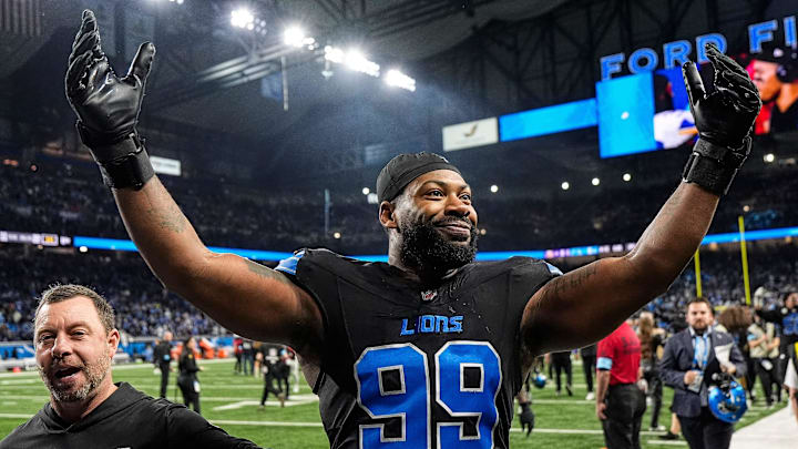 Detroit Lions defensive end Za'Darius Smith (99) celebrates 31-9 win over Minnesota Vikings as he exits the field at Ford Field in Detroit on Sunday, Jan. 5, 2025.